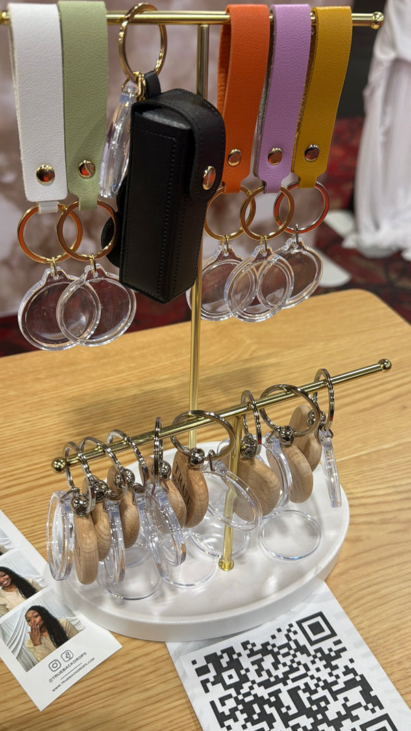 Event-ready acrylic photo keychain set with straps, featuring photo booth accessories from True Backdrops.