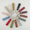 Event-ready acrylic photo keychain set with straps, featuring colorful photo booth accessories from True Backdrops.