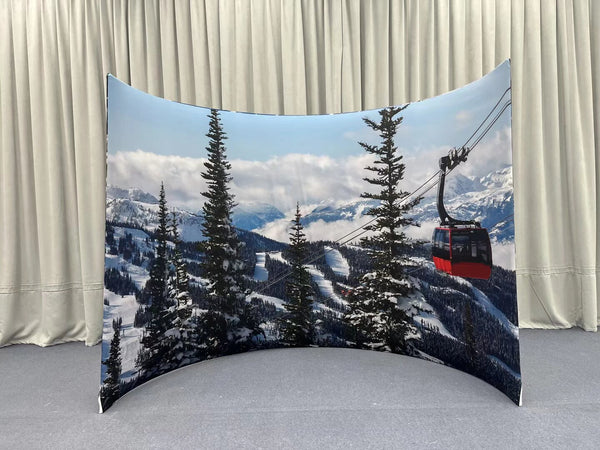 Curved enclosure wall by True Backdrops, featuring smooth fabric surface and sturdy frame for professional photography setup.