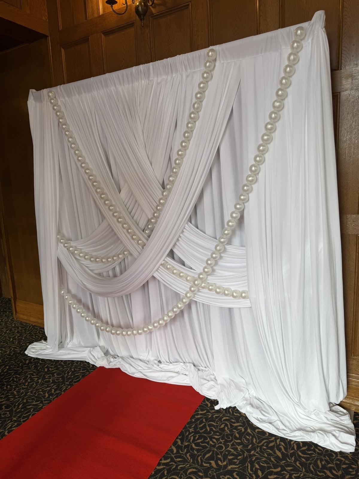 White physical drapery and pearl details in a customer setup
