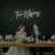 Wedding Last Names Custom Neon Sign by Light Your Way, showcasing illuminated personalized wedding decor on a sleek black background.