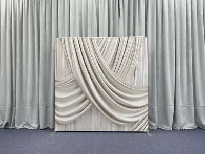 Champagne silk drapes pillowcover backdrop with soft, luxurious fabric and elegant design for photography or decor settings.