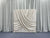 Champagne silk drapes pillowcover backdrop with soft, luxurious fabric and elegant design for photography or decor settings.