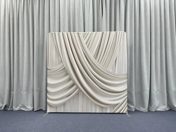 Champagne silk drapes pillowcover backdrop with soft, luxurious fabric and elegant design for photography or decor settings.