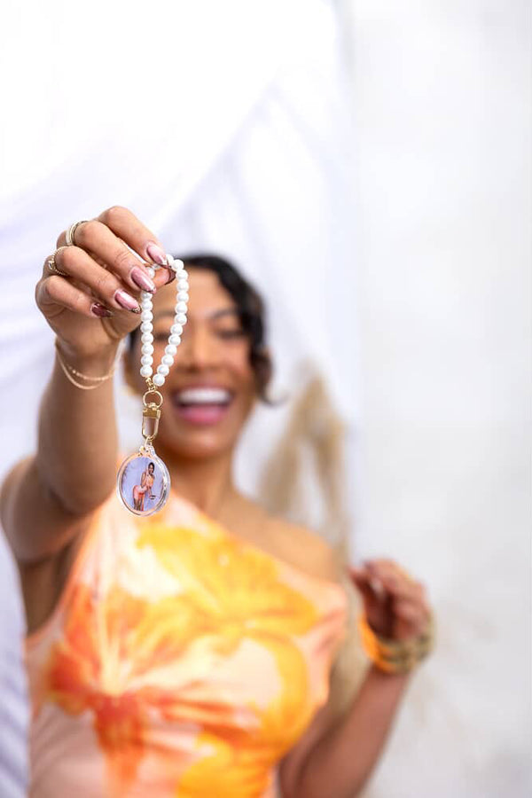Event-ready acrylic photo keychain set with pearls, featuring photo booth accessories from True Backdrops.