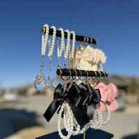 Event-ready acrylic photo keychain set with pre-assembled bows, part of True Backdrops' photo booth accessories collection.