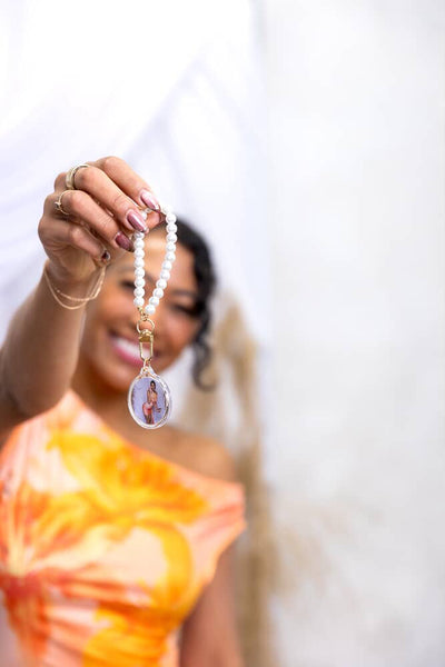 Event-ready acrylic photo keychain set by True Backdrops featuring pre-assembled photo booth accessories with pearls and decorative elements.