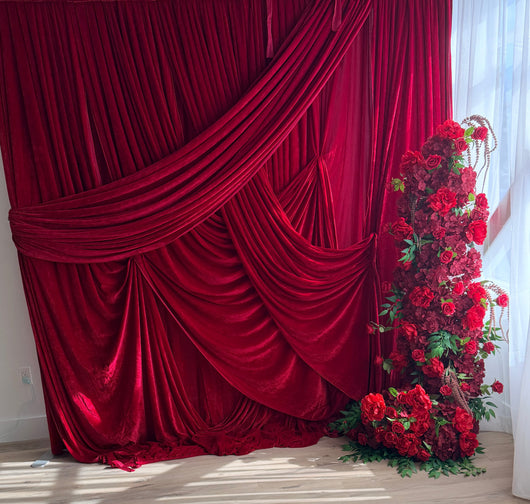 Pre-pleated velvet drapery backdrop with pole pocket in rich color, designed for elegant event or photo studio setups.