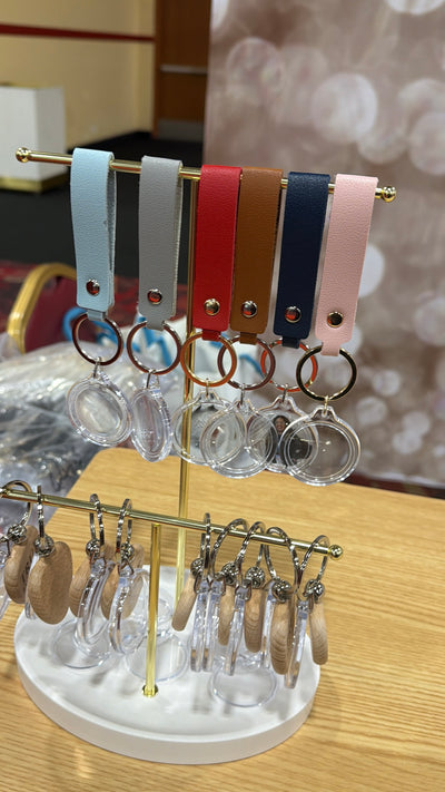 Event-ready acrylic photo keychain set with straps, featuring colorful photo booth accessories by True Backdrops.