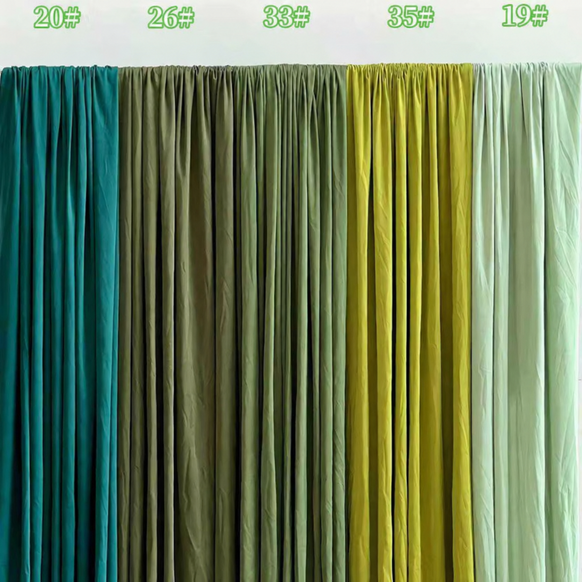 Pre-pleated drapery backdrop with pole pocket by True Backdrops, showing fabric texture and hanging design for stage or photo setups.