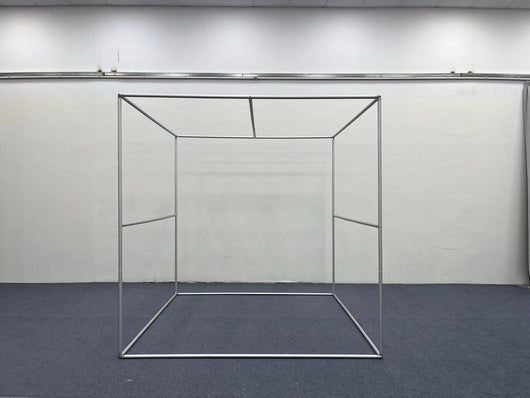RecyclingDisplay 8x8x8 3D photography enclosure used as a room scene photo booth backdrop in a professional studio setting.