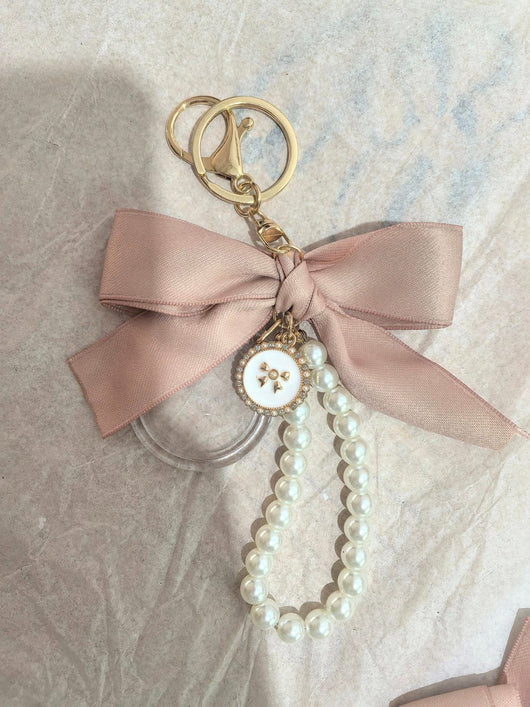 Event-ready acrylic photo keychain set with bows, featuring True Backdrops' photo booth accessories for fun photo moments.