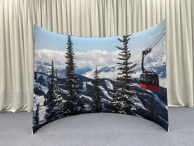 Curved enclosure wall by True Backdrops, featuring smooth fabric surface and sturdy frame for professional photography setup.