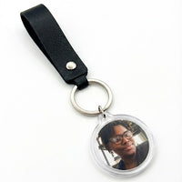 Event-ready acrylic photo keychain set with straps, featuring colorful photo booth accessories by True Backdrops.