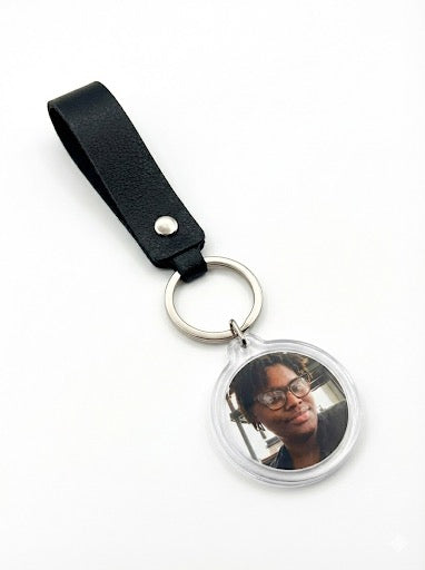 Event-ready acrylic photo keychain set with straps, featuring colorful photo booth accessories by True Backdrops.