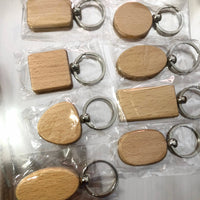 Event-ready acrylic photo keychain set by True Backdrops featuring pre-assembled photo booth accessories with wooden tags.