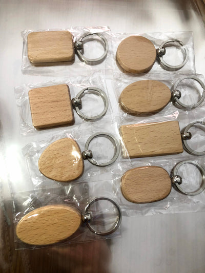 Event-ready acrylic photo keychain set by True Backdrops featuring pre-assembled photo booth accessories with wooden tags.