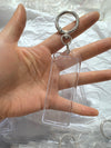 True Backdrops 1x3 photo strip keychain set featuring photo booth accessories with colorful printed strips and keychain attachments.