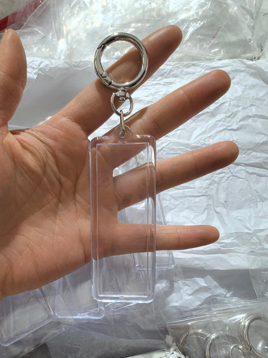 True Backdrops 1x3 Photo Strip Keychain set featuring colorful photo booth accessories with attached photo strips.