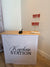 Recycling station keychain attached to a fabric pop-up counter by RecycleDisplay, showcasing portable event display setup.