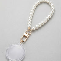 Event-ready acrylic photo keychain set with pearl accents, featuring photo booth accessories by True Backdrops.