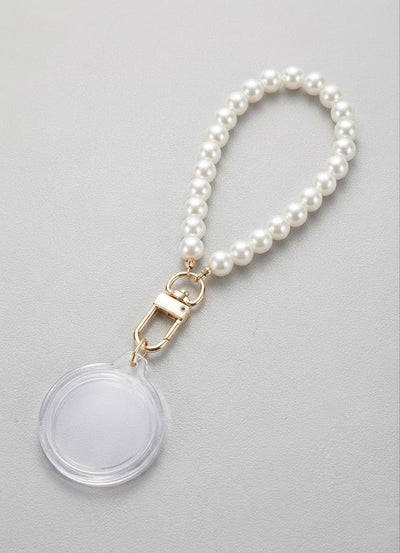 Event-ready acrylic photo keychain set with pearl accents, featuring photo booth accessories by True Backdrops.