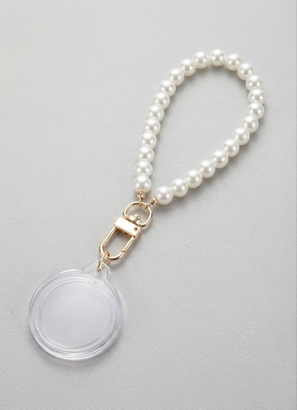 Event-ready acrylic photo keychain set with pearl accents, featuring photo booth accessories by True Backdrops.