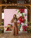 True Backdrops Orchard Picnic Bliss pillowcover backdrop featuring a vibrant outdoor picnic scene with colorful pillows and greenery.