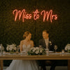 Light Your Way Miss to Mrs Neon Sign for weddings, featuring illuminated "Miss to Mrs" lettering on a vibrant neon display.