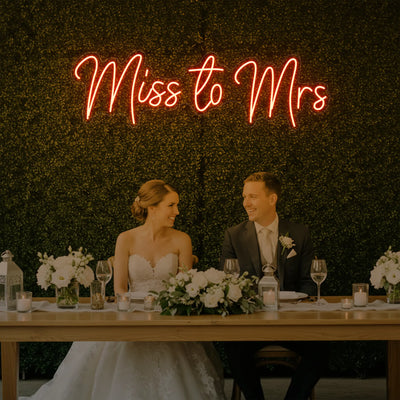 Light Your Way Miss to Mrs Neon Sign for weddings, featuring illuminated "Miss to Mrs" lettering on a vibrant neon display.