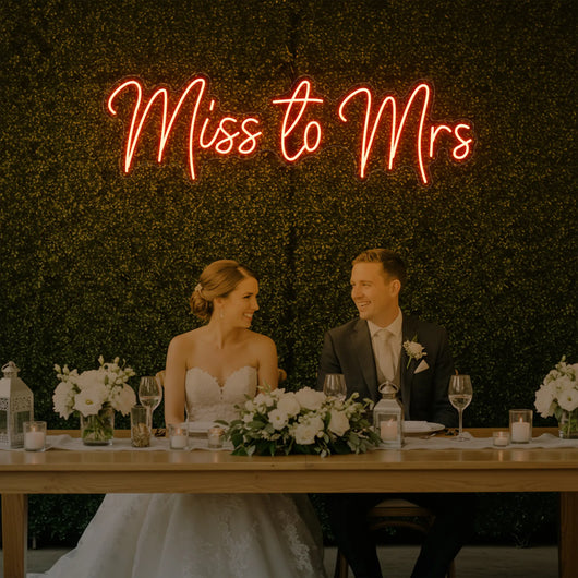Light Your Way Miss to Mrs Neon Sign for weddings, featuring illuminated "Miss to Mrs" lettering on a vibrant neon display.