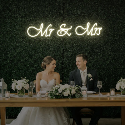 Light Your Way Mr & Mrs V2 wedding neon sign glowing with bright LED lights, perfect for wedding decor and celebrations.