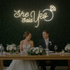 Light Your Way She Said Yes wedding neon sign with bright LED lights on a dark background, perfect for wedding decor.