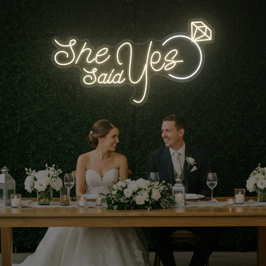 Light Your Way She Said Yes wedding neon sign with bright LED lights on a dark background, perfect for wedding decor.