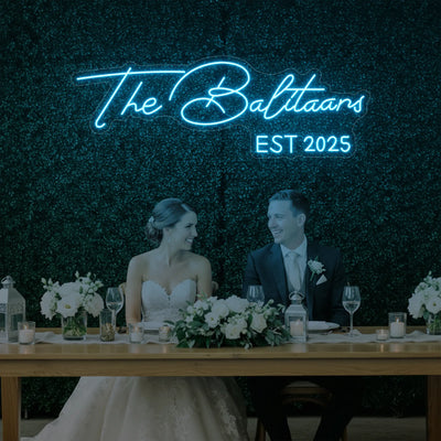 Custom wedding neon sign with last names, illuminated in stylish neon lights, perfect for wedding decor by Light Your Way.
