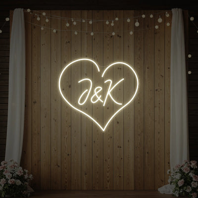 Custom wedding initials neon sign by Light Your Way, featuring personalized glowing initials for wedding decor.