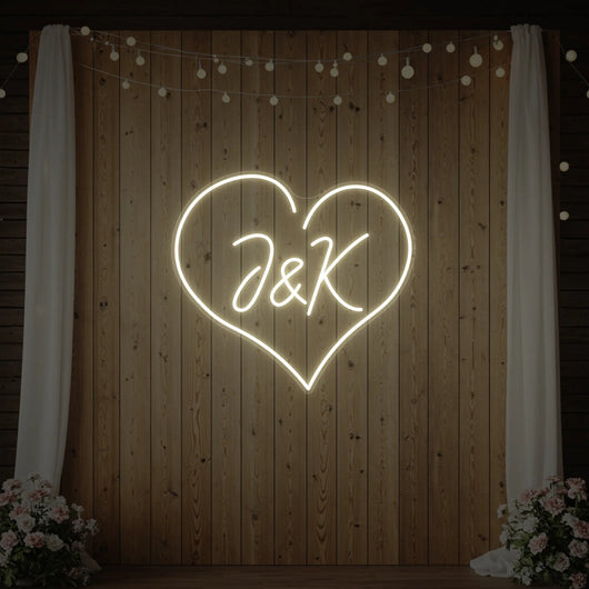 Custom wedding initials neon sign by Light Your Way, featuring personalized glowing initials for wedding decor.