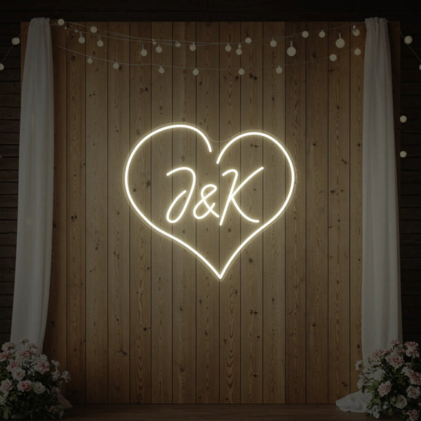 Custom wedding initials neon sign by Light Your Way, featuring personalized glowing initials for wedding decor.