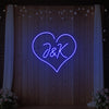 Custom wedding initials neon sign by Light Your Way, glowing pink with elegant script, perfect for wedding decor.