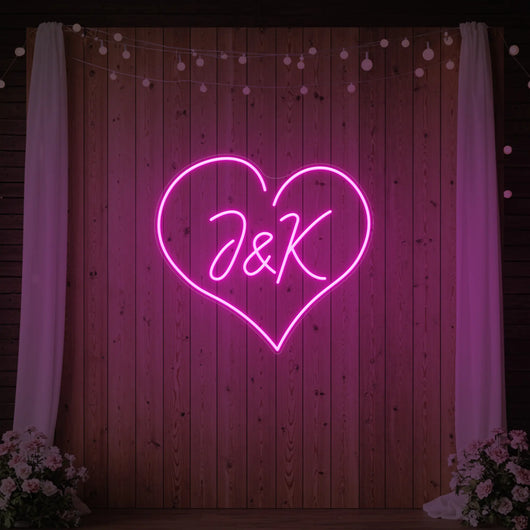 Custom wedding initials neon sign by Light Your Way, featuring glowing initials perfect for wedding decor and celebrations.