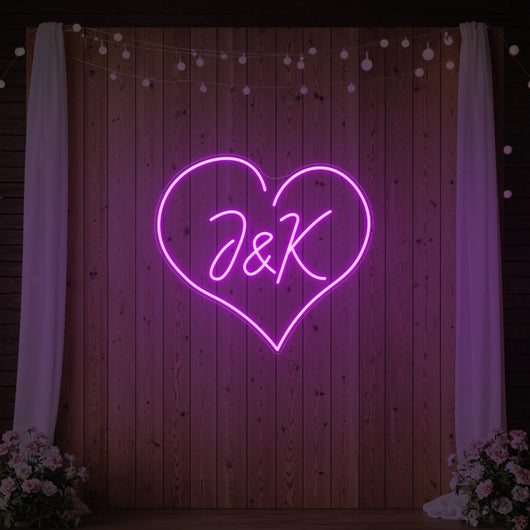 Wedding initials custom neon sign by Light Your Way, vibrant illuminated initials for wedding decor in a modern style.