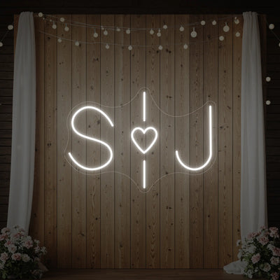 Custom neon sign for weddings with initials, illuminated in vibrant colors, by Light Your Way, perfect for wedding decor.