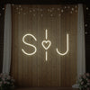 Custom wedding initials neon sign by Light Your Way with glowing initials on a dark background, perfect for wedding decor.