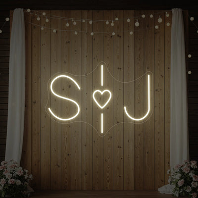 Custom wedding initials neon sign by Light Your Way with glowing initials on a dark background, perfect for wedding decor.