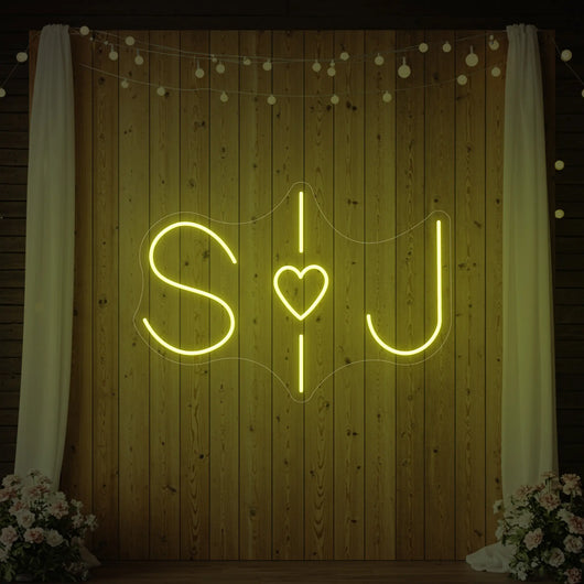 Custom wedding initials neon sign by Light Your Way, glowing with stylish personalized neon lights for wedding decor.