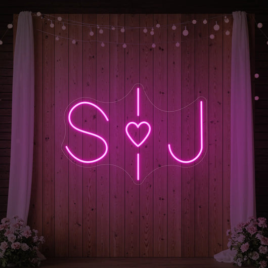 Wedding initials custom neon sign by Light Your Way, glowing white with elegant script for wedding decor.