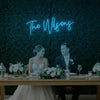 Custom wedding last names neon sign by Light Your Way, featuring illuminated personalized wedding décor on a black background.